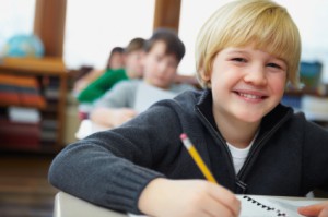 happy-boy-student-with-pencil-300x199
