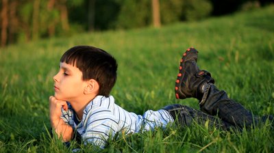 boy lying in grass