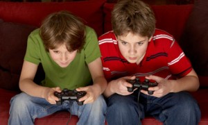 teenage boys playing video game